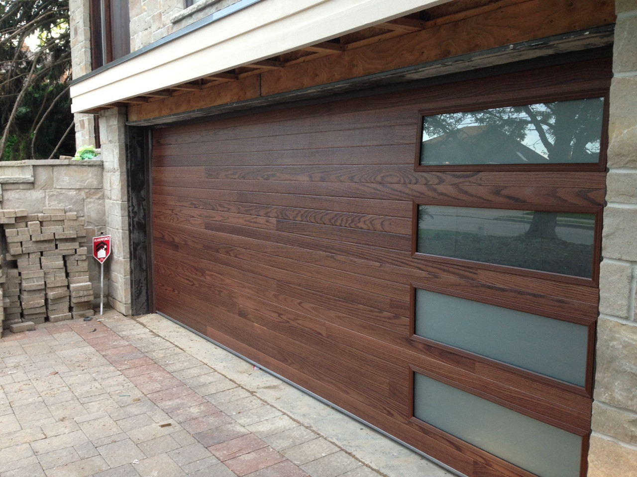 Dark mahogany garage door with frosted glass panels